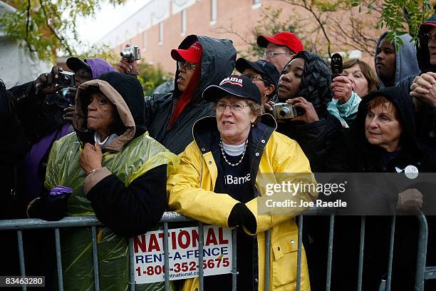 People wait to shake hands with Democratic presidential nominee U.S. Sen. Barack Obama in the rain during a campaign rally at Widener University Main...