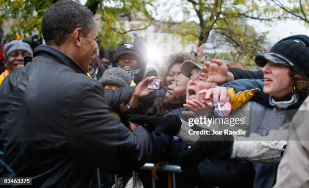 Democratic presidential nominee U.S. Sen. Barack Obama shakes hands with people during a campaign rally at Widener University Main Quad October 28,...