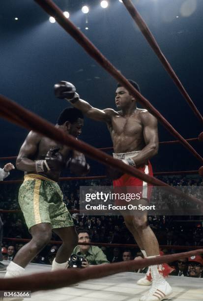 Muhammad Ali throws a punch at Joe Frazier during the WBC/WBA heavyweight title fight March 8, 1971 at Madison Square Garden in New York, New York.