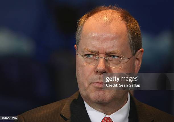 German Finance Minister Peer Steinbrueck talks to the media after a meeting with finance experts and Chancellor Angela Merkel at the Chancellery on...
