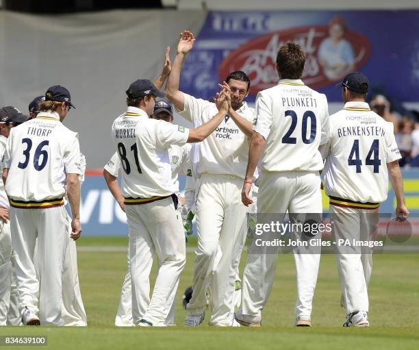 Durham's Steve Harmison is congratulated by his team mates after taking the wicket of Yorkshire's Michael Vaughan during the LV County Championship,...