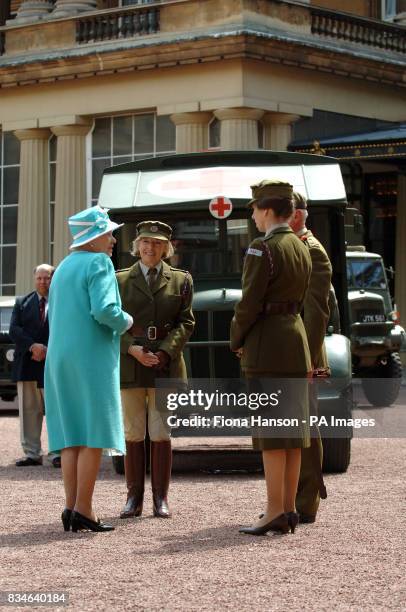 The Queen and The Princess Royal, who is Commandant-in-Chief of the First Aid Nursing Yeomany, arrives to inspect vintage vehicles used by the...