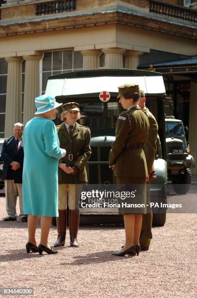 The Queen and The Princess Royal, who is Commandant-in-Chief of the First Aid Nursing Yeomany, arrives to inspect vintage vehicles used by the...