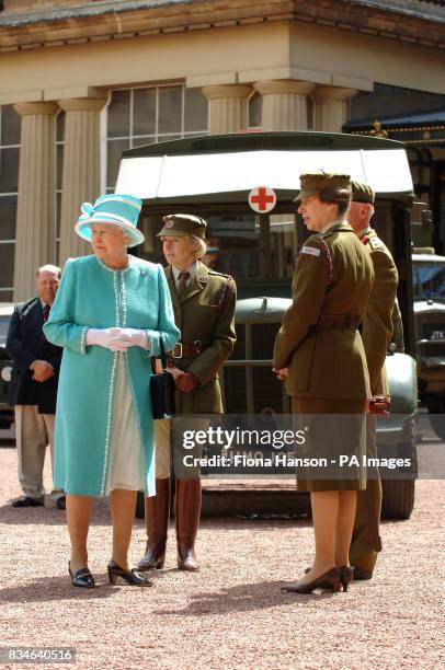 The Queen and The Princess Royal, who is Commandant-in-Chief of the First Aid Nursing Yeomany, arrives to inspect vintage vehicles used by the...