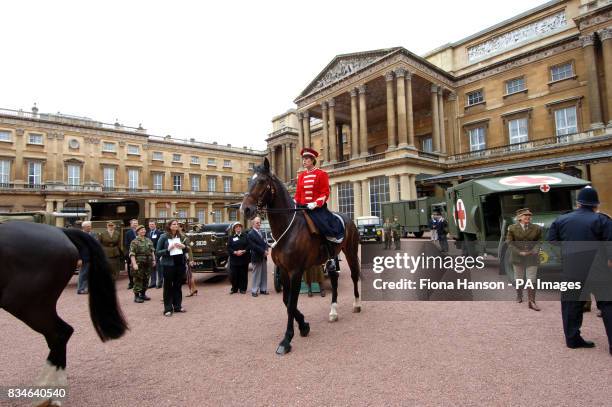 Vintage vehicles used by the First Aid Nursing Yeomanry during WWII, which were assembled in the quadrangle of Buckingham Palace, London.