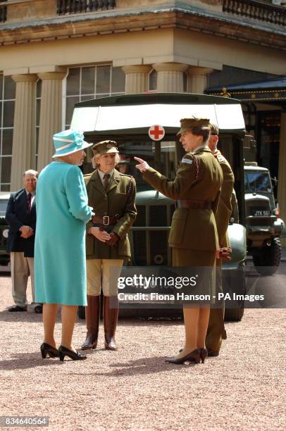 The Queen and The Princess Royal, who is Commandant-in-Chief of the First Aid Nursing Yeomany, arrives to inspect vintage vehicles used by the...