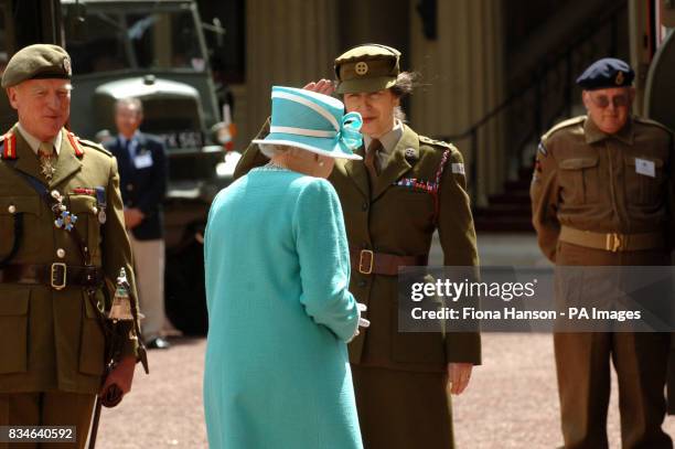 The Queen and The Princess Royal, who is Commandant-in-Chief of the First Aid Nursing Yeomany, arrives to inspect vintage vehicles used by the...