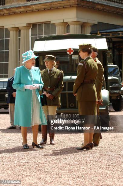 The Queen and The Princess Royal, who is Commandant-in-Chief of the First Aid Nursing Yeomany, arrives to inspect vintage vehicles used by the...