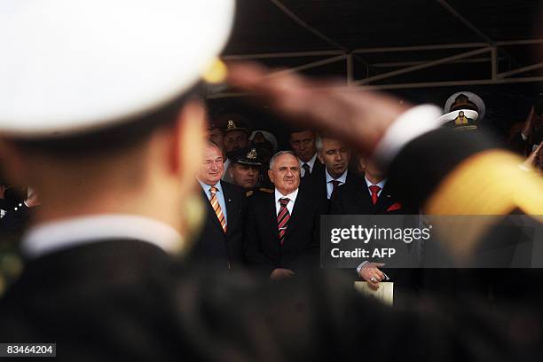 Turkish Defence Minister Becdi Gonul watches the military parade in the northern Greek city of Thessaloniki marking the Greek national holiday and...