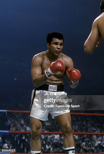 Muhammad Ali looks for an opening against Alfredo Evangelista during a WBC/WBA heavyweight championship fight on May 16, 1977 at the Capital Center...