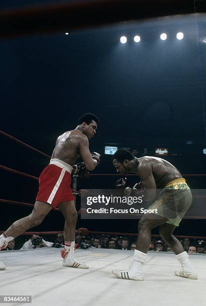 Muhammad Ali throws a punch at Joe Frazier during the WBC/WBA heavyweight title fight March 8, 1971 at Madison Square Garden in New York, New York.