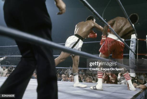 Muhammad ALi in action throws a punch against Ron Lyle in a heavyweight fight, May 16, 1975 in Las Vegas, NV.