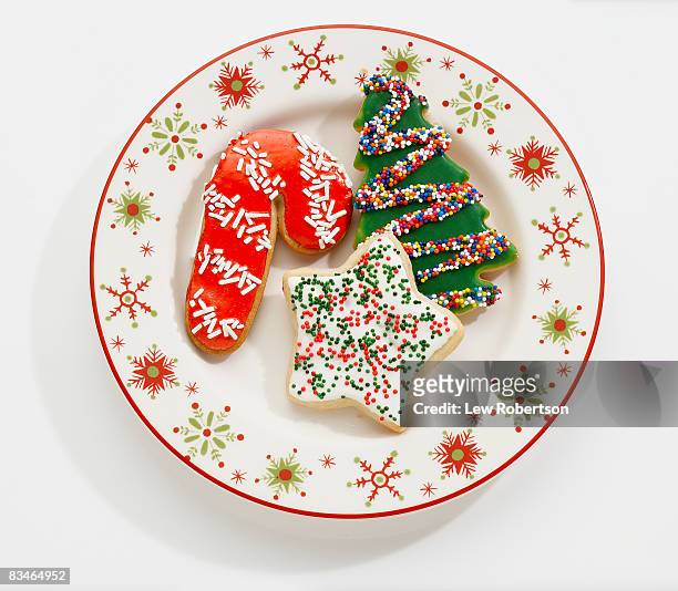 christmas cookies on holiday plate - christmas plate stock pictures, royalty-free photos & images