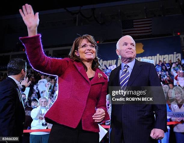 Republican presidential candidate John McCain and his vice presidential candidate Sarah Palin wave at a campaign rally at Giant Center in Hershey,...