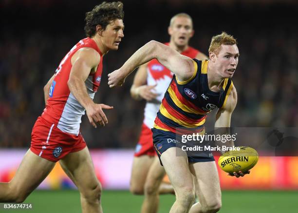 Tom Lynch of the Crows and Kurt Tippett of the Swans competes during the round 22 AFL match between the Adelaide Crows and the Sydney Swans at...