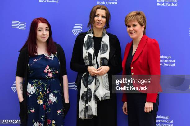 Scotland's First Minister Nicola Sturgeon poses for photographs with author Elif Shafak and publisher Heather McDaid during the Edinburgh...