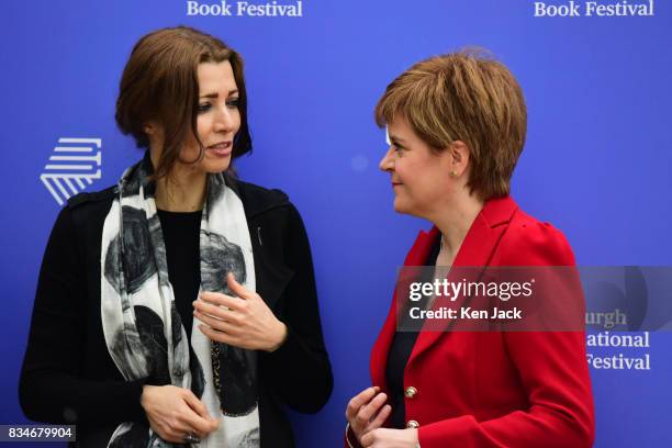 Scotland's First Minister Nicola Sturgeon poses for photographs with author Elif Shafak during the Edinburgh International Book Festival on August...
