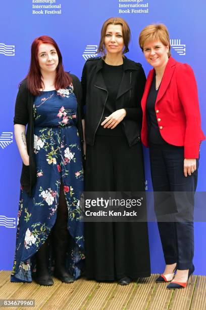 Scotland's First Minister Nicola Sturgeon poses for photographs with author Elif Shafak and publisher Heather McDaid during the Edinburgh...
