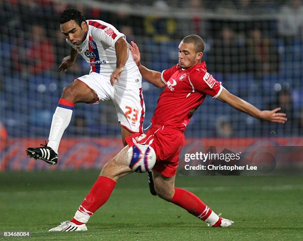 Paul Ifill of Crystal Palace kicks the ball past Joel Lynch of Forest during the Coca-Cola Championship match between Crystal Palace and Nottingham...