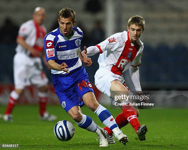 Jared Wilson of Birmingham battles with Martin Rowlands of QPR during the Coca-Cola Championship match between Queens Park Rangers and Birmingham...