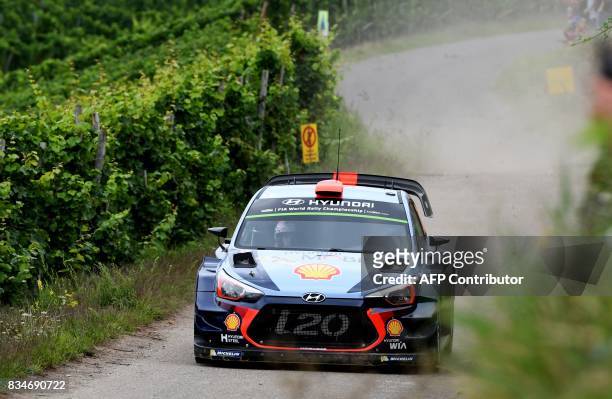 Dani Sordo of Spain and his co-driver Marc Marti of Spain steer their Hundai I20 WRC during stage 3 of the Rally Germany in Klueserath near Trier,...