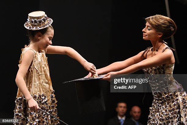 French singer Julie Zenatti displays a creation made from chocolate at the 14th Chocolate fair on October 28, 2008 in Paris. AFP PHOTO ALIX GUIGON