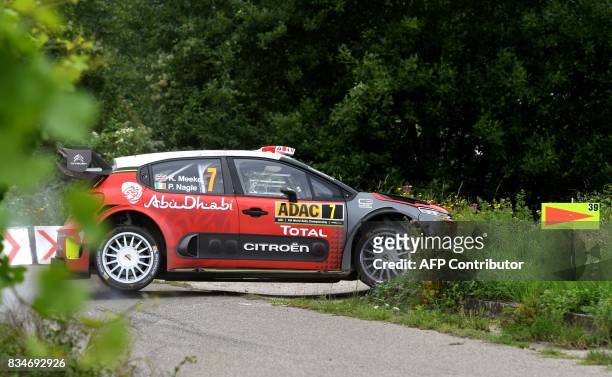 Kris Meeke of Britain and his co-driver Paul Nagle of Ireland steer their Citroen C3 WRC during stage 3 of the Rally Germany in Klueserath near...