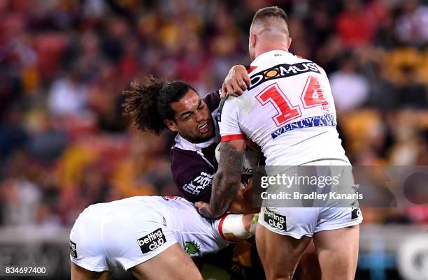 Adam Blair of the Broncos takes on the defence during the round 24 NRL match between the Brisbane Broncos and the St George Illawarra Dragons at...