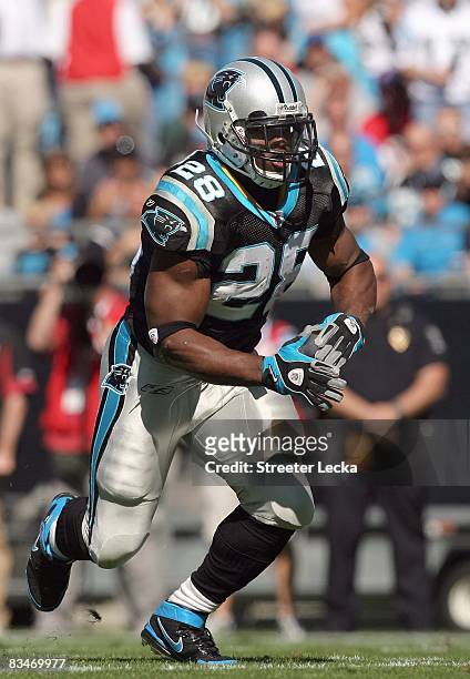 Jonathan Stewart of the Carolina Panthers moves to grab the ball during the game against of the Arizona Cardinals at Bank of America Stadium on...