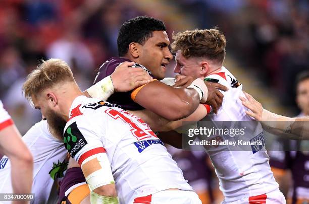 Tevita Pangai Junior of the Broncos takes on the defence during the round 24 NRL match between the Brisbane Broncos and the St George Illawarra...