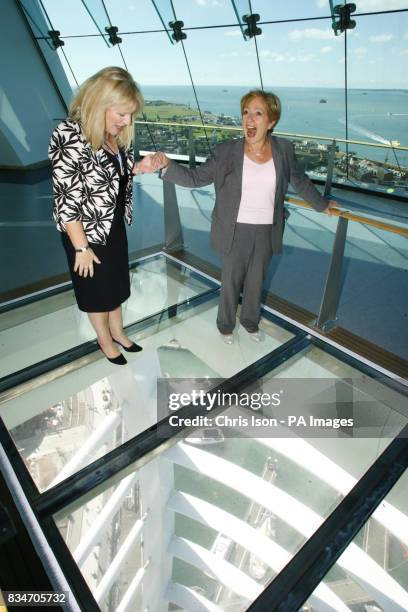 Tourism Minister Margaret Hodge walking across the glass floor of the Spinnaker Tower in Portsmouth, with Deputy Chief Executive of Continuum Juliana...