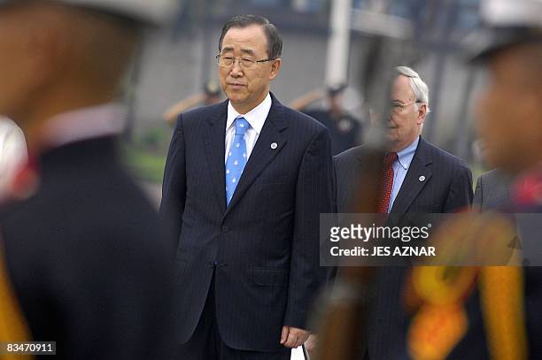 United Nations Secretary General Ban Ki-moon walks past honor guards during a wreath-laying ceremony at the Luneta park in Manila on October 29,...