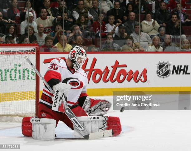 Cam Ward the Carolina Hurricanes makes a save in a game against the Montreal Canadiens at Bell Centre on October 28, 2008 in Montreal, Quebec, Canada.