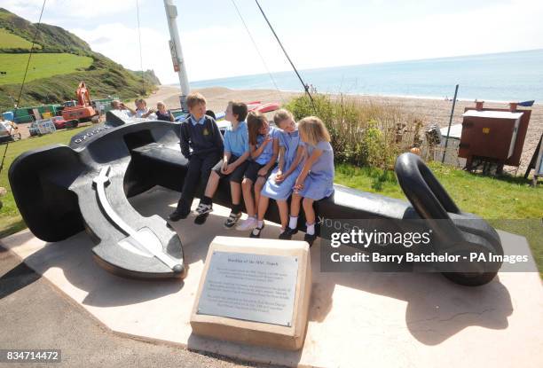 Thomas, George, Emily, Maryre and Autumn - Children from Branscombe Church of England Primary School - sit on the anchor of the MSC Napoli on the...