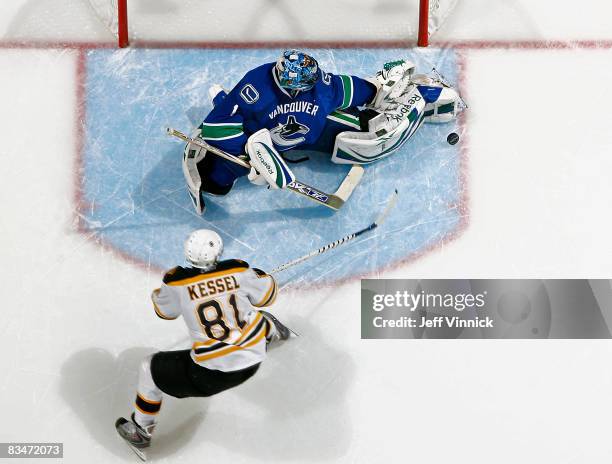 Roberto Luongo of the Vancouver Canucks makes a save off the shot of Philip Kessel of the Boston Bruins during their game at General Motors Place on...