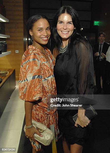 Joy Bryant and Angie Harmon at the Vogue and Step Up Women's Network fashion event at Bally on October 28, 2008 in Beverly Hills, California.