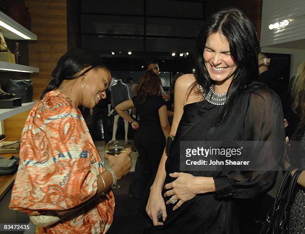 Joy Bryant and Angie Harmon at the Vogue and Step Up Women's Network fashion event at Bally on October 28, 2008 in Beverly Hills, California.
