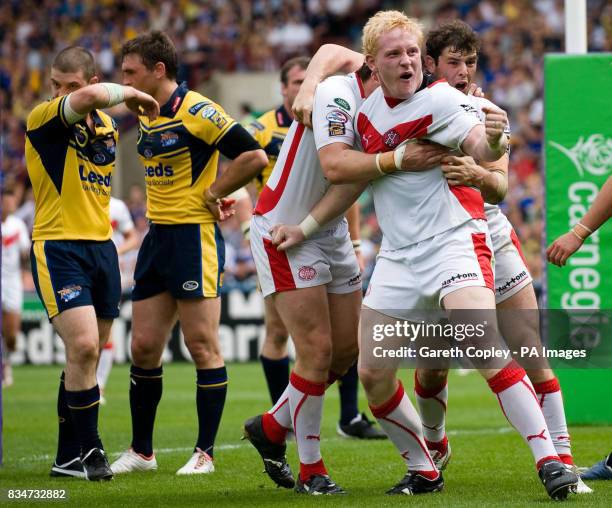 St Helens's Byan Hargreaves celebrates his try with James Graham and Paul Wellens during the Carnegie Challenge Cup Semi Final at the Galpharm...