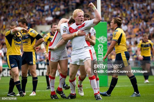 St Helens' Byan Hargreaves celebrates with James Graham after scoring a try during the Carnegie Challenge Cup Semi Final at the Galpharm Stadium,...