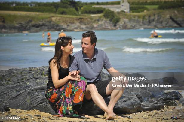 Conservative Party leader David Cameron and his wife Samantha relax on Harlyn Bay beach near Padstow, Cornwall on the first day of their summer...