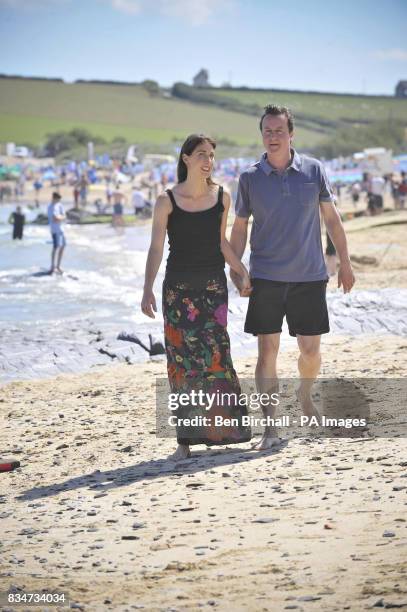 Conservative Party leader David Cameron and his wife Samantha relax on Harlyn Bay beach near Padstow, Cornwall on the first day of their summer...