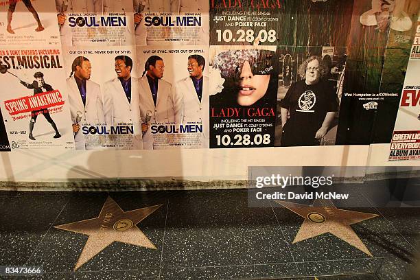 Ad bills hang above Hollywood Walk of Fame stars where a demolition crew is tearing down the historic Universal Pictures Building on the northwest...