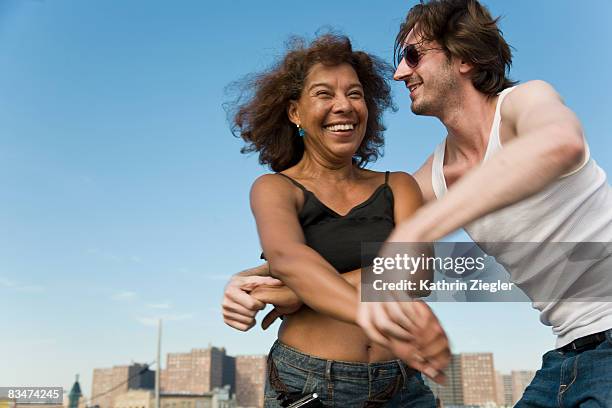 couple dancing salsa on the boardwalk - salsa lateinamerikanischer tanz stock-fotos und bilder