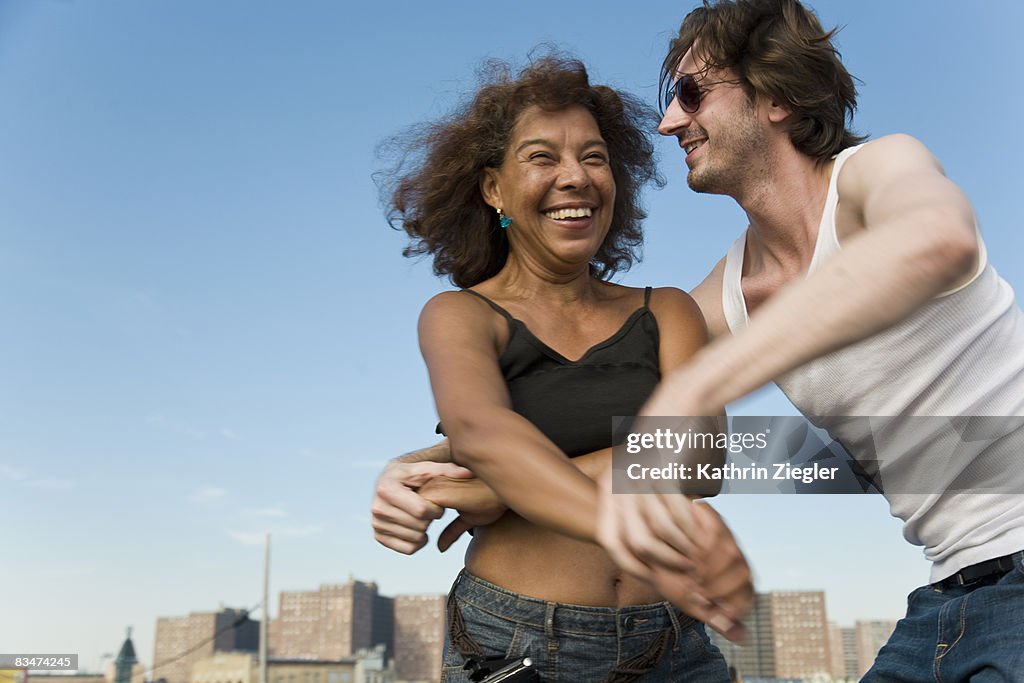 Couple dancing salsa on the boardwalk