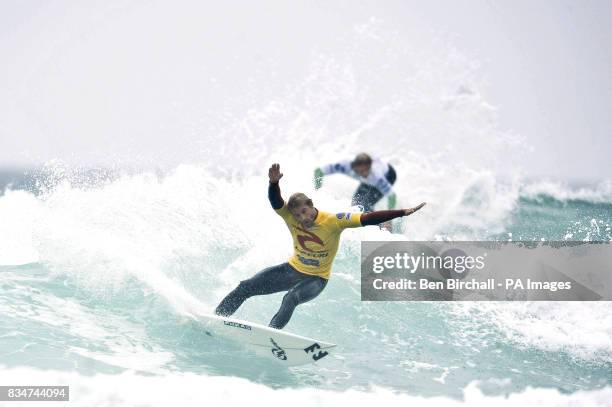 Rod Adams Rip Curl France's Thomas Bady performs in front of Great Britain's Alan Stokes ...
