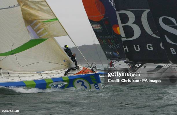 The crew aboard Mike Golding's Ecover change sails as the fleet of high-tech Open 60 yachts approach The Needles during the Artemis Challenge round...