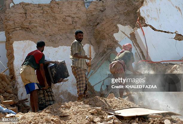 Yemenis search for their processions from under the rubble of their collapsed homes in the historical city of Shibam in Hadramaut province of eastern...