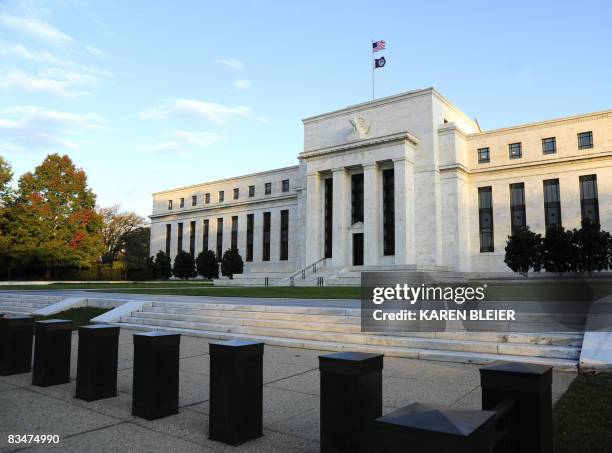 The sun splashes light on the Federal Reserve Building early October 29, 2008 in Washington, DC. The US Federal Reserve was widely expected to...