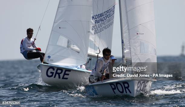Greece's Andreas Kosmatopolous and Andreas Papadopoulos chase Portugal's Alvaro Marinho and Miguel Nunes during the Men's 470 Opening Series in...