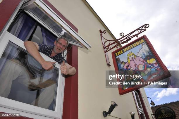 Pub owner Peter Gower-Crane stands inside his pub The Victoria in St Werburghs, Bristol, which has caused controversy by swapping a sign of Queen...